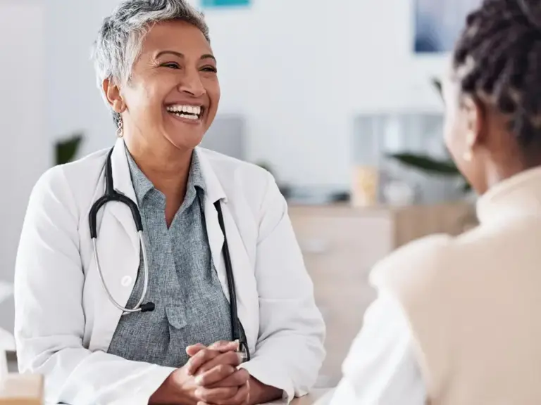 A community health worker consulting with a program participant.
